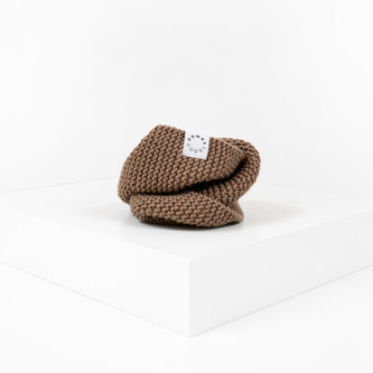 Wet Sand Hand knitted snood for dogs depicted in white studio.