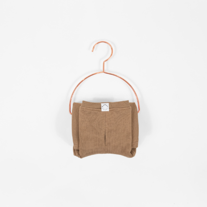 Cozy Waistcoat in color of Cafe au Lait displayed on a hanger.