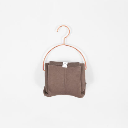 Cozy Waistcoat in color of Cocoa displayed on a hanger.