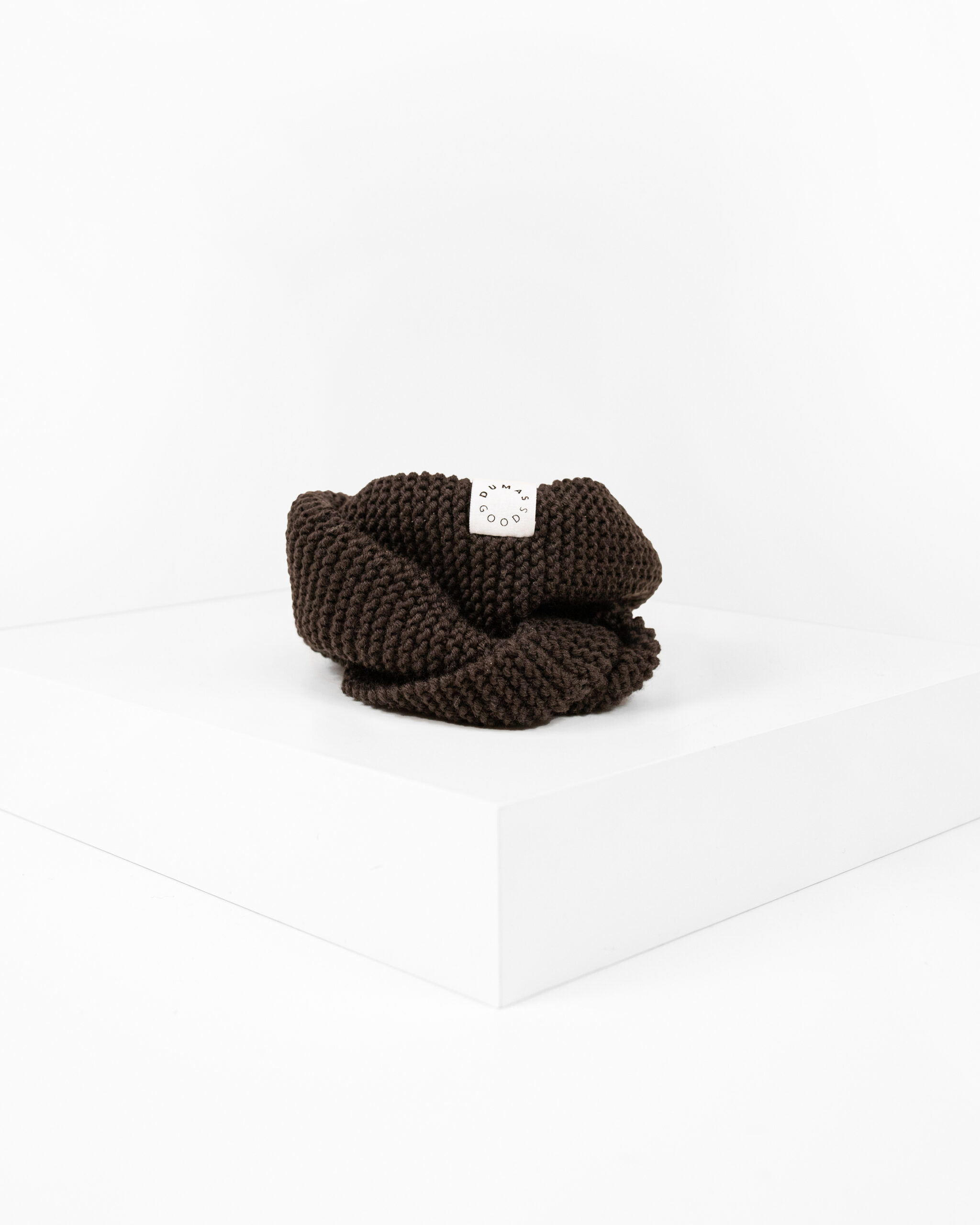 Brown Hand knitted snood for dogs depicted in white studio.