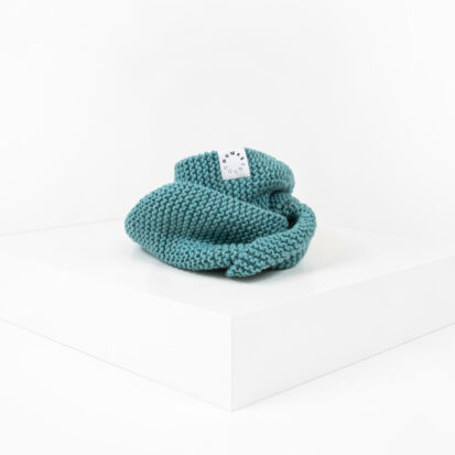 Duck Blue Hand knitted snood for dogs depicted in white studio.