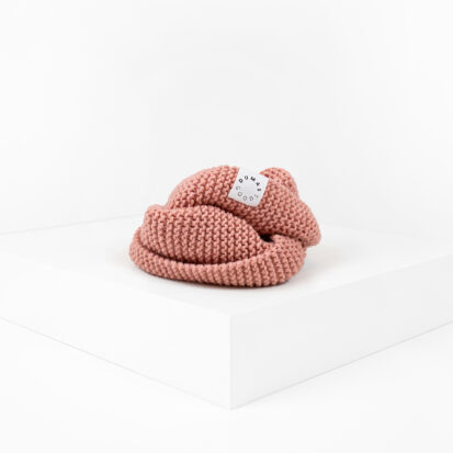 Peachy Pink Hand knitted snood for dogs depicted in white studio.