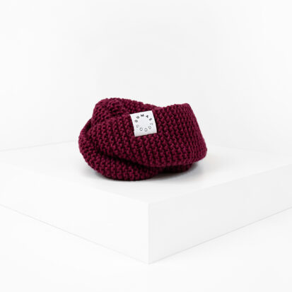 Red Wine Hand knitted snood for dogs depicted in white studio.