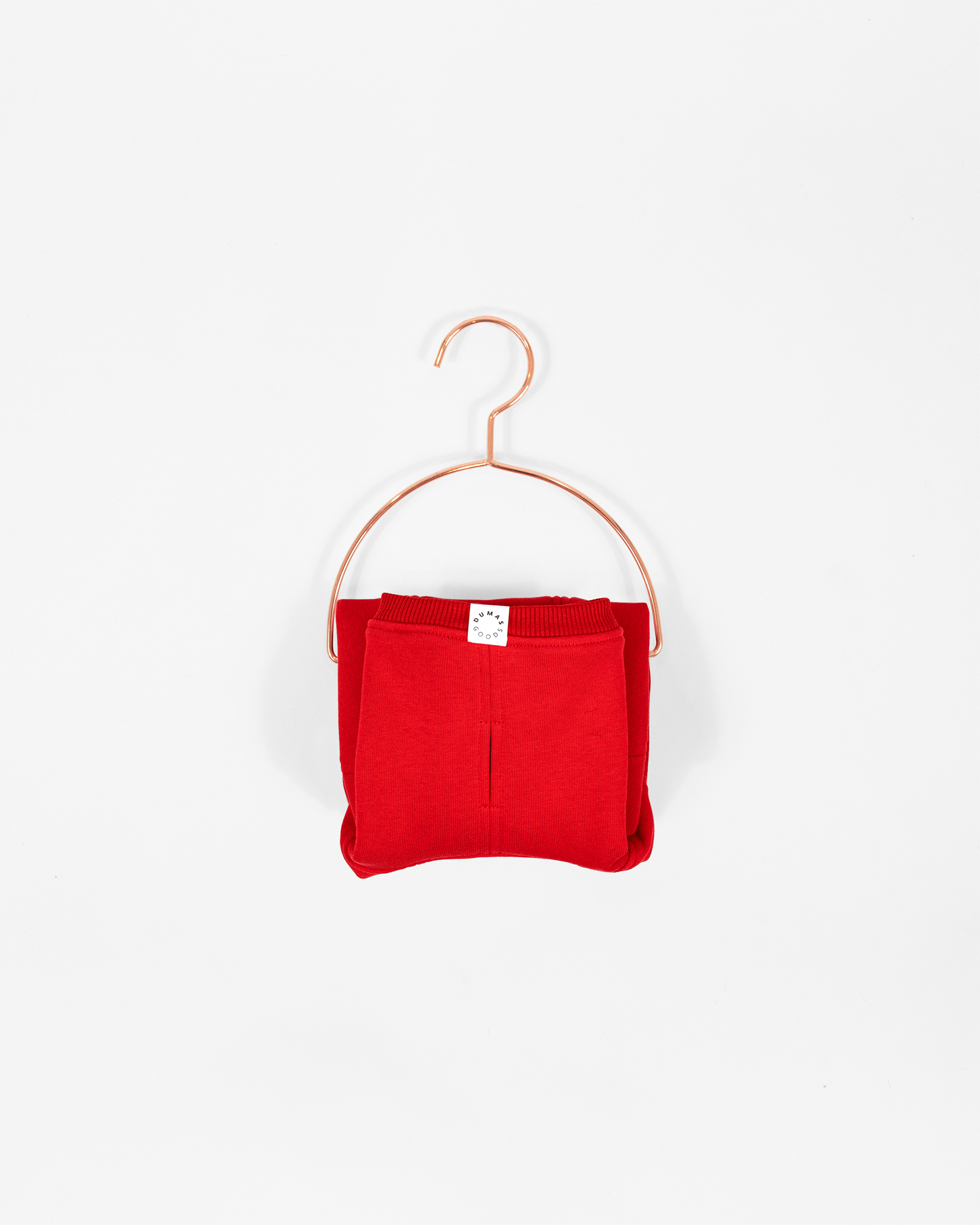 Cozy Waistcoat in red color displayed on a hanger.